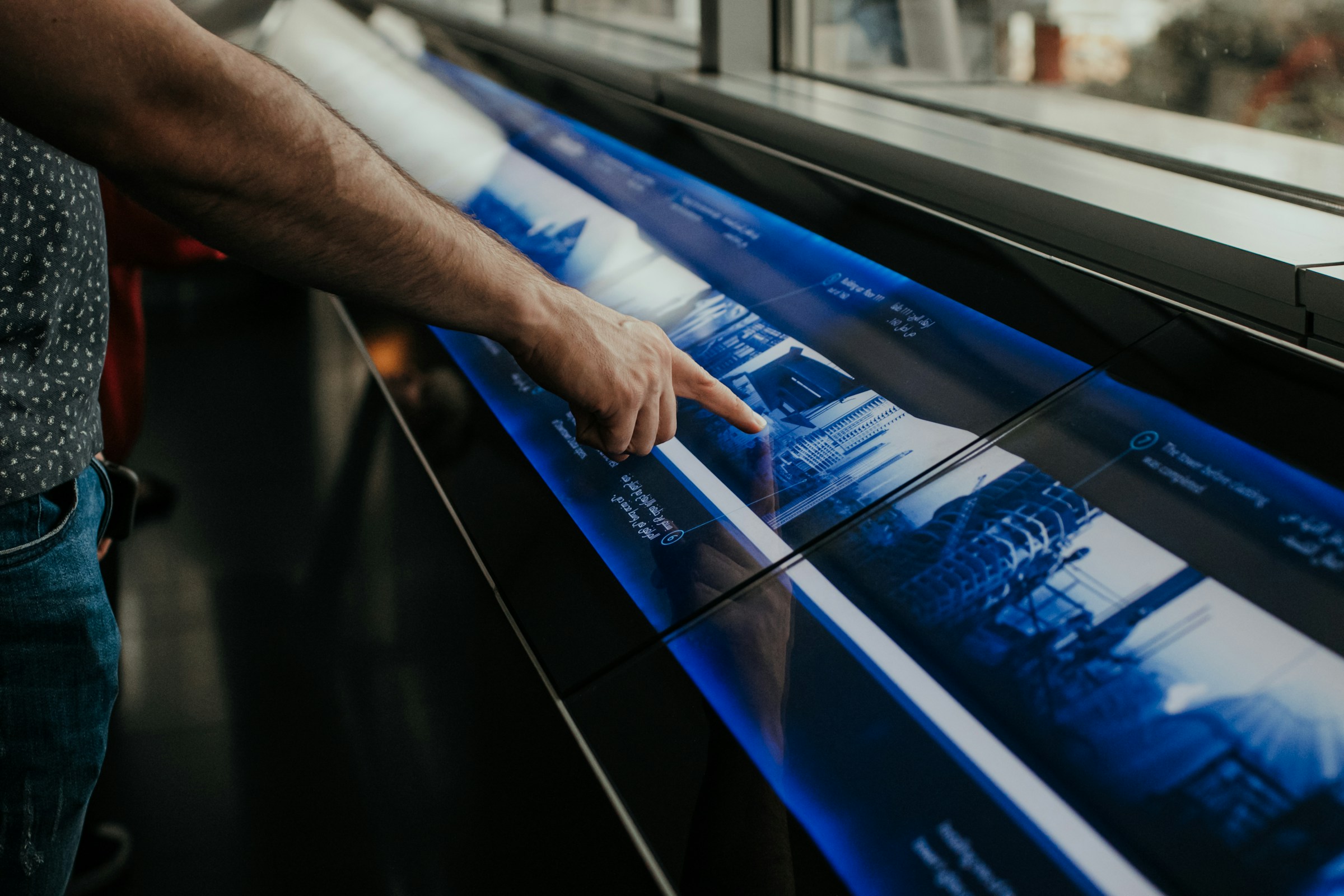 Person click on large touchscreen