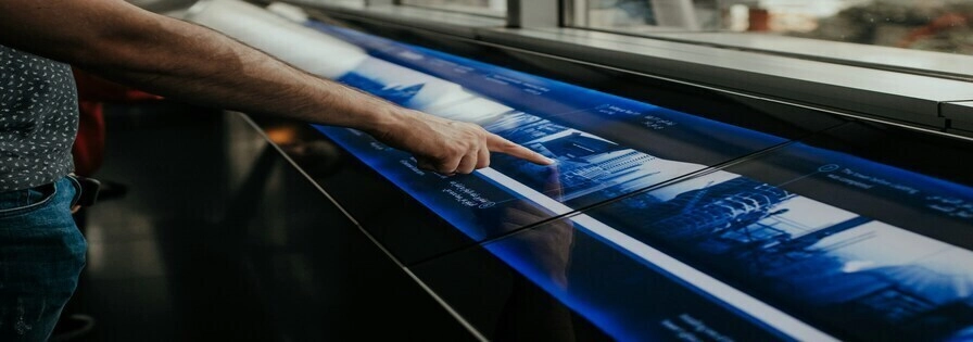Person click on large touchscreen