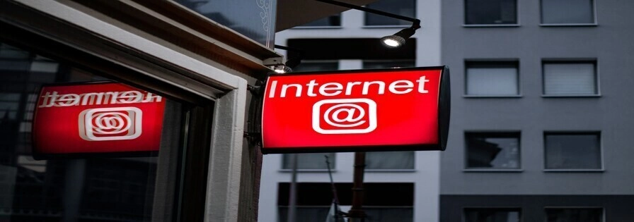 Internet led sign beside building near buildings